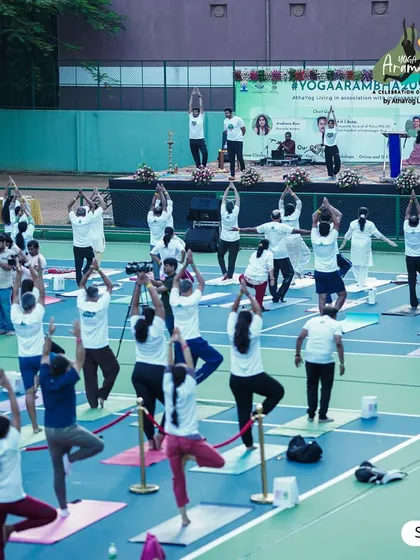 A view from the stage at Yoga Arambha 2024. The sight of everyone moving in unison, finding their balance in Tree Pose (Vrikshasana), is always an inspiring moment.