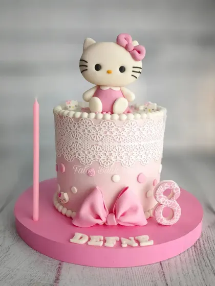 The cutest Hello Kitty cake for an 8th birthday! The delicate lace detail, big pink bow, and perfect Hello Kitty topper make this a dream cake for any fan.