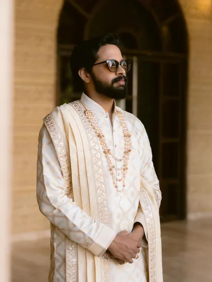 A stylish groom in a classic sherwani. We take the time to shoot portraits that are both timeless and reflective of the groom's personal style.