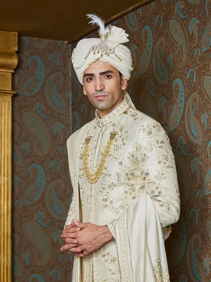 A closer look at the fine embroidery and the jeweled sarpech on the safa. These are the details that transform a garment into a cherished heirloom.