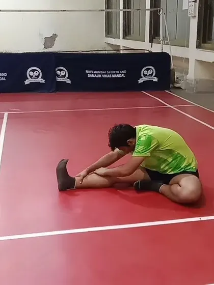 A seated forward bend helps to stretch the hamstrings and lower back. Maintaining flexibility in these areas is crucial for a low, athletic stance.