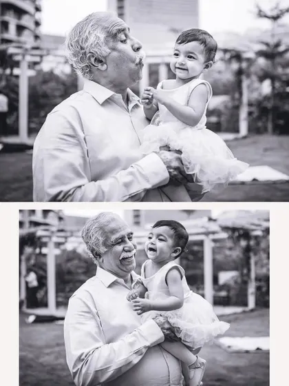 The pure joy and laughter between a grandfather and his granddaughter, captured in timeless black and white. We focus on the special bonds that make family parties memorable.