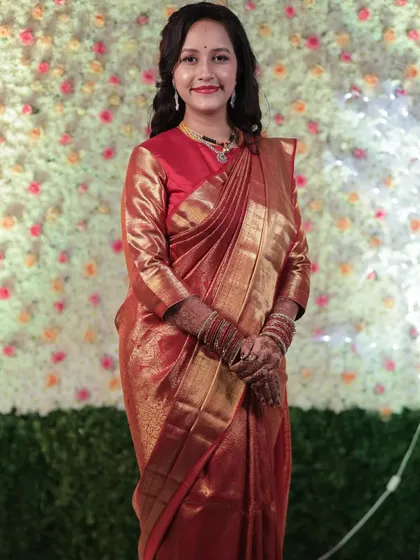 A full-length shot showing the beautiful drape of the saree and how the makeup completes the entire ensemble.