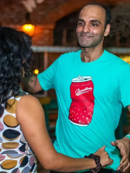 A relaxed and happy dancer enjoying the music. The cool t-shirt adds a touch of personality.