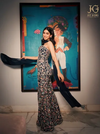 A full-length shot of Khushi Kapoor, looking graceful and elegant in a floral gown and our diamond earrings.