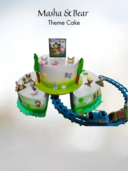 All aboard the celebration express! This Masha and the Bear theme cake features a real, moving toy train that circles the different cake sections. It’s an interactive design that keeps the kids entertained long after they've had their slice.