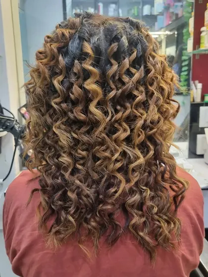 For those who love curls, I created this fun and bouncy pencil curls look. The highlights in her hair really make the curls pop.