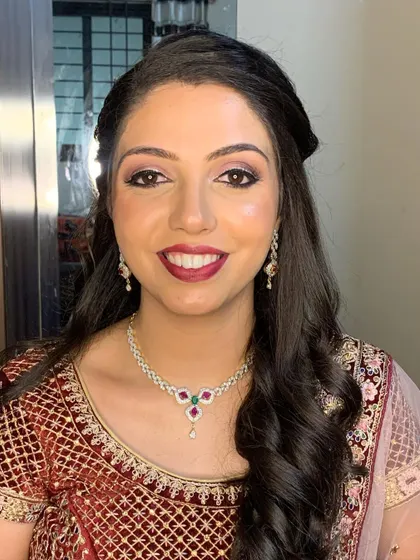 A smiling shot of the final reception look. I teach how to ensure your makeup not only looks good but also feels comfortable and lasts through hours of smiling and celebrating.