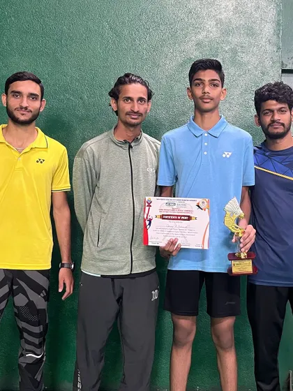 Shivaraj with his coaches, celebrating a bronze medal win in the Under-15 Boy's Doubles at the Yonex-Sunrise Karnataka State Ranking Tournament.