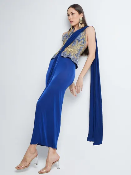 Another angle of the unique pose for The Luxury Pop, highlighting the flow and structure of the modern saree-style dress.