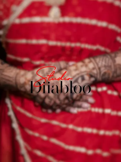 A close-up detail shot of the bride's hands, showcasing her intricate Mehendi design. I believe in capturing these small, artistic details that are a significant part of the wedding tradition.