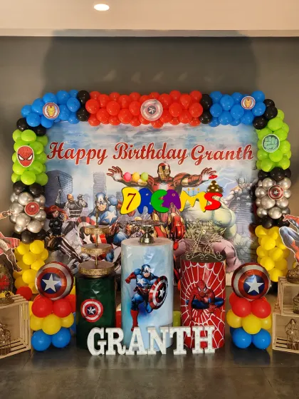 For the ultimate superhero fan, I created this full Avengers stage. It features a custom backdrop with all the heroes, balloon columns in character colors, and life-size cutouts of Captain America, Iron Man, and Spider-Man.
