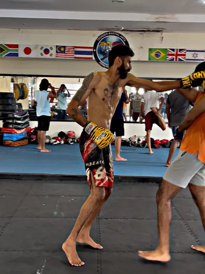 A student lands a clean jab during a sparring session. This is the result of drilling fundamentals until they become second nature.