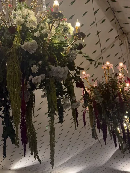 Golden blooms for a golden evening. For this wedding dinner party, our ceiling floral installations with warm, autumnal colors set a soft, wild, and glowing scene as the evening unfolded.