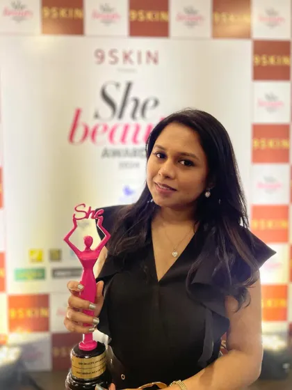 Holding my first major award after eight years of dedication. This pink lady represents my belief that success comes from consistency, hard work, and a genuine passion for the craft.