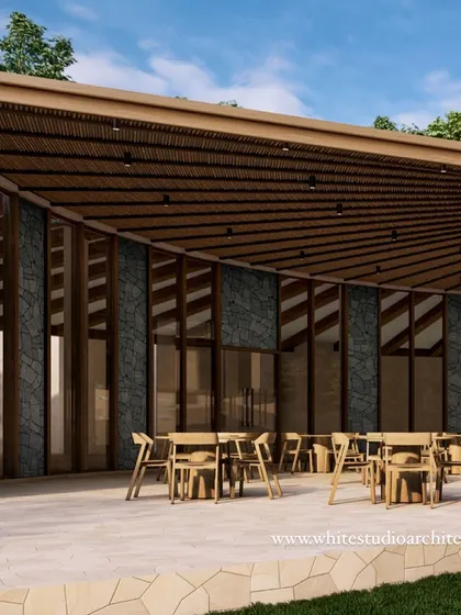 An architectural render of an all-day dining space for a riverside resort in Dehradun. The curved facade of wood and stone, along with an open-air terrace, is designed to harmonize with the natural surroundings and offer a seamless indoor-outdoor experience.