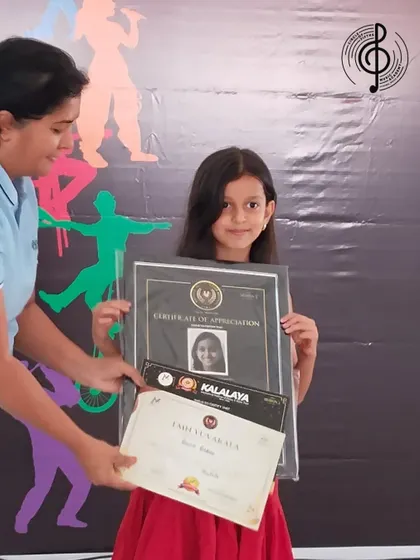Aira receives her certificate of appreciation at the Kalalaya event. We celebrate every achievement, big or small.