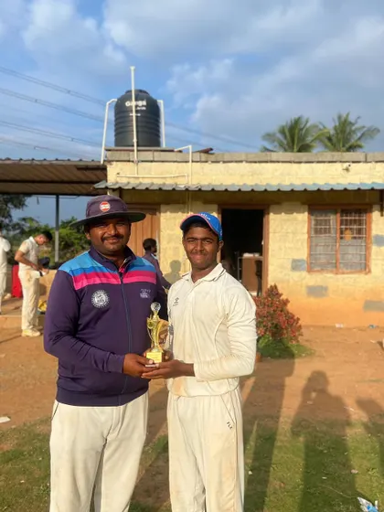 Gagan Ajit Kumar receiving his award after a spectacular knock of 119 not out in a corporate tournament, showcasing his batting prowess and endurance.