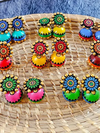 These images display the extensive variety of earrings I create, from jhumkas to studs and danglers, all showcasing different patterns, colors, and shapes ready for bulk orders.