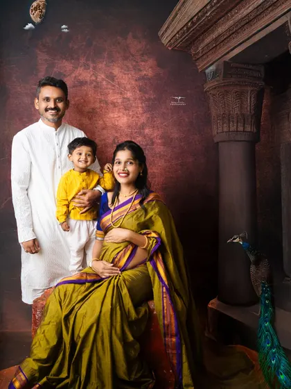 Another beautiful family pose from the same traditional session, capturing the loving bond between parents and their child against a fine art backdrop.