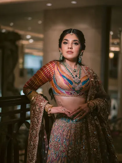 This image showcases the full garba look, with a colorful lehenga and statement jewellery. I teach how to balance all these elements for a cohesive look.