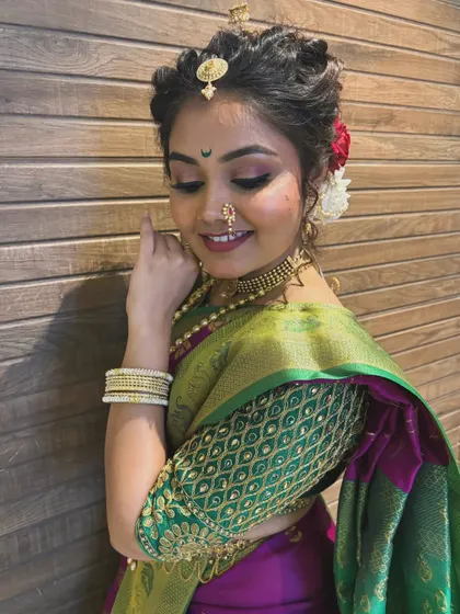 A close-up on the Gudi Padwa look, highlighting the soft pink and gold eye makeup and the traditional crescent bindi, which are signatures of Maharashtrian beauty.