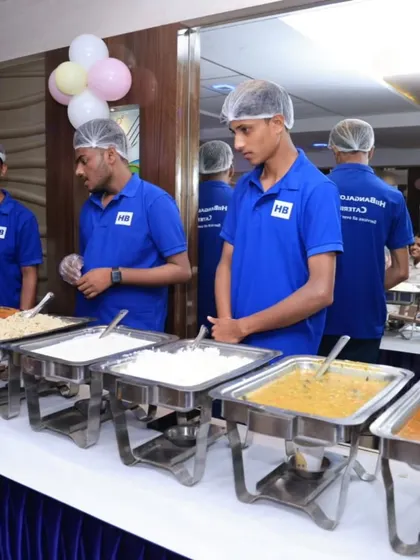 Our team managing the buffet at a birthday party, ensuring all dishes are replenished and the area is kept clean.