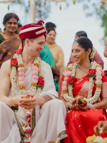 A joyful moment between a multicultural couple during their traditional South Indian wedding ceremony. We celebrate love in all its forms and excel at capturing cross-cultural weddings.