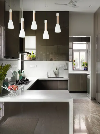 This is where style meets function. I designed this modern kitchen to be the heart of the home, with sleek, high-gloss cabinetry, a durable quartz countertop, and an open layout that is perfect for both everyday cooking and entertaining guests. The pendant lights add a touch of warmth and sophistication.