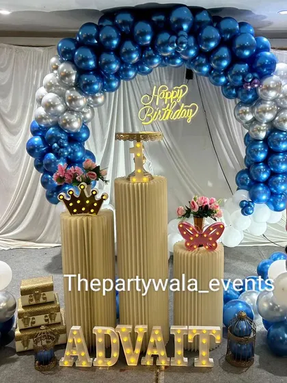 A beautiful Boss Baby setup with shiny blue and silver chrome balloons. The light-up name and character cutouts complete this stylish party look.