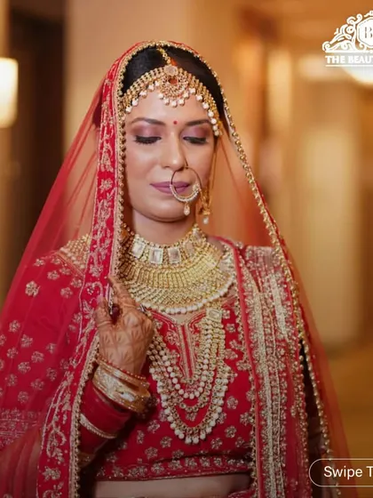 A classic bridal pose showing off the beautiful makeup and the sheer dupatta. I always make sure the makeup is visible yet elegant, even when veiled.