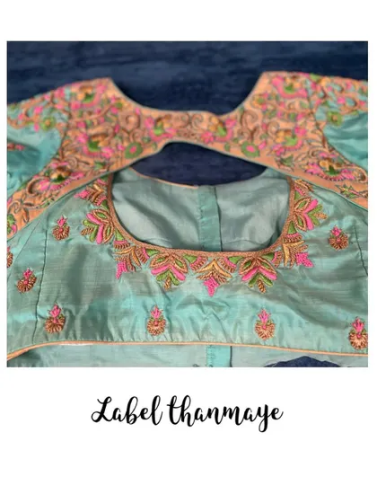 The front and back pieces of the pastel green blouse, ready for stitching.