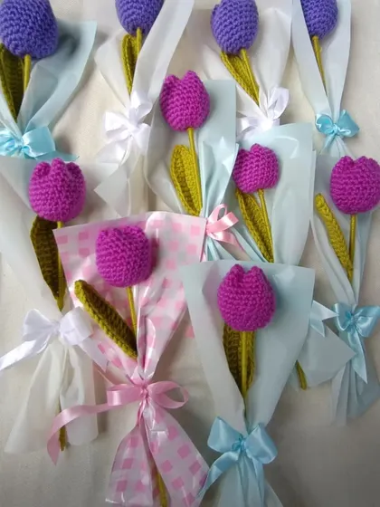 Individually wrapped purple and magenta tulips.