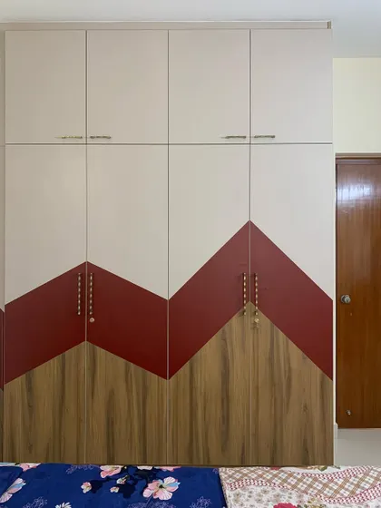 The kids' bedroom in this apartment features a playful, zig-zag pattern on the wardrobe using three different laminates. It's a great example of how we can create fun and unique designs on a budget.