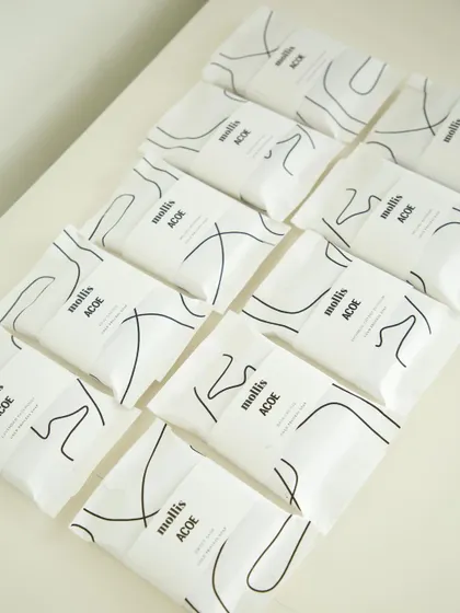 An array of the custom soaps created for the Airbnb corporate order, showing the clean and modern packaging design.