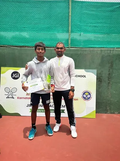 Ishaan Yadlapalli holding the Super Series singles title he clinched in Bangalore. Super Series tournaments are highly competitive, and this win reflects his superior conditioning and tactical gameplay.