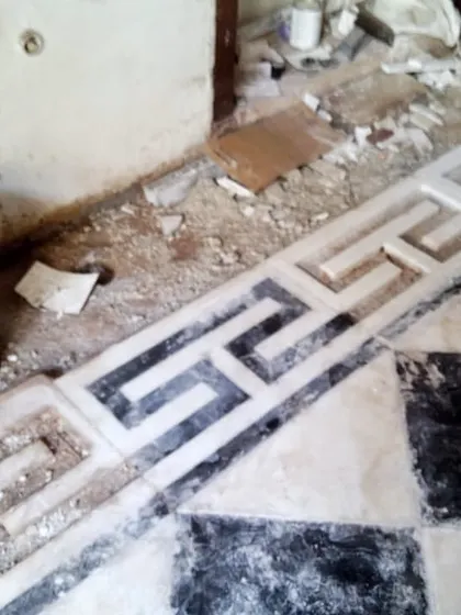During the restoration process, we carefully uncovered and repaired the original marble flooring, including the intricate Greek key border. This detail work is crucial for preserving the authentic character of a heritage building.