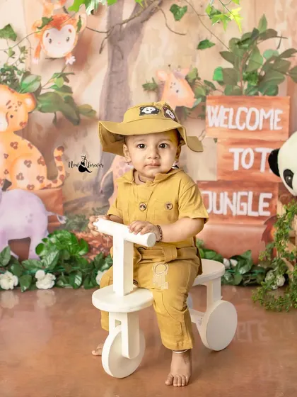 This little adventurer is exploring the jungle on his bike. The detailed backdrop and props create an immersive and fun experience.