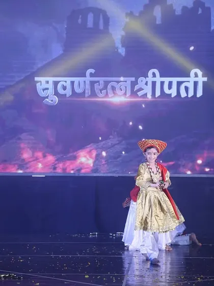 The lead performer in our Tanaji act, set against a backdrop that reads "Suvarnaratnashreepati," adding to the historical theme.