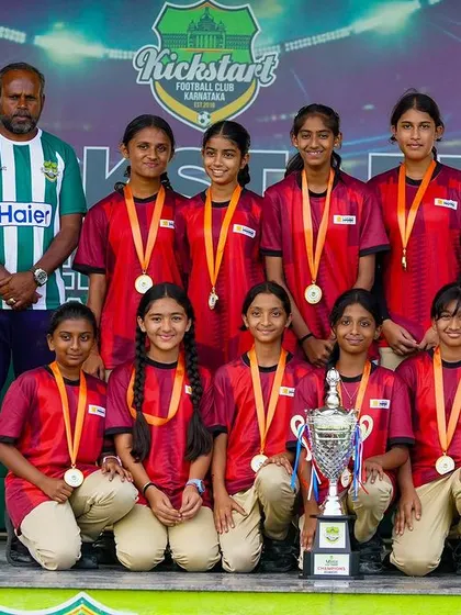 The pride of representing your school. Here is the Gopalan National School U-15 girls' team, crowned champions at our inter-school tournament, displaying their medals and trophy with honor.