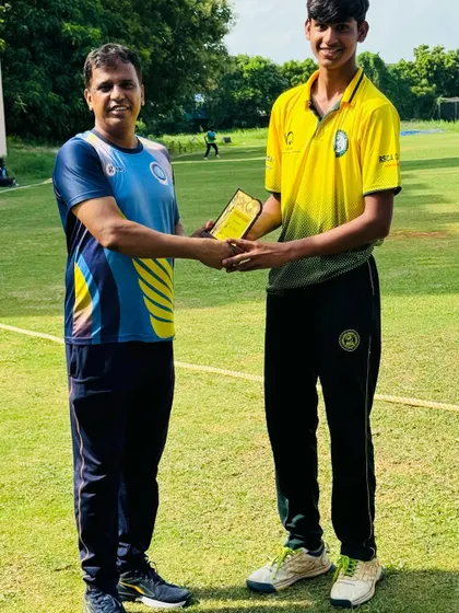 A player receives an award for his performance during the Chennai tour.