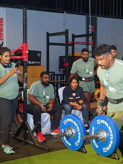 The Farmer's Walk in a competition setting. Speed is key. It's a race against the clock while carrying an immense load in each hand, testing your physical and mental limits.