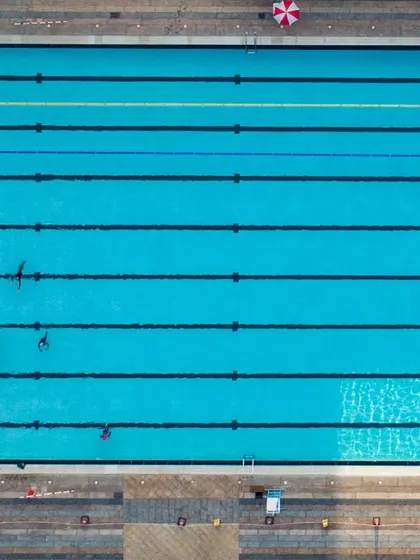 The clean lines and clear water of our 50m pool from above. It's a perfect environment for focused lap swimming.
