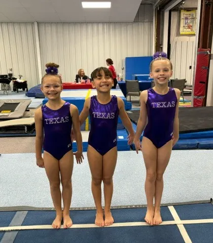 Three of our Level 3 gymnasts, all smiles after a great competition season.