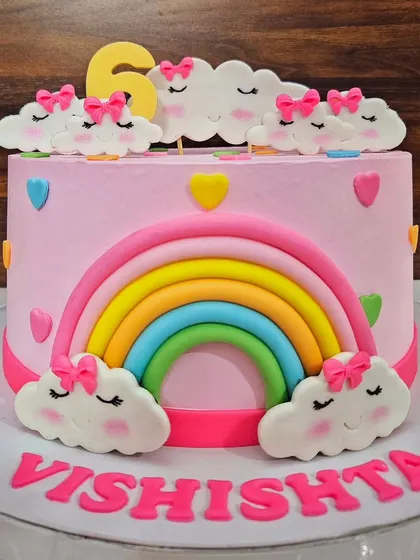 Same same but different! A cute rainbow and cloud cake for Vishishta's 6th birthday, made with a delicious blueberry flavor.
