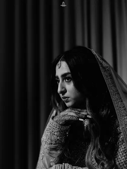 A duplicate of ID 363, this black and white portrait captures a Muslim bride's pensive and elegant pose.