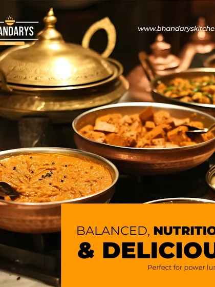 A close-up of our traditional copper and brass serving bowls, filled with a variety of balanced and nutritious dishes. This is the kind of power lunch I provide, ensuring the food is not just delicious but also wholesome.