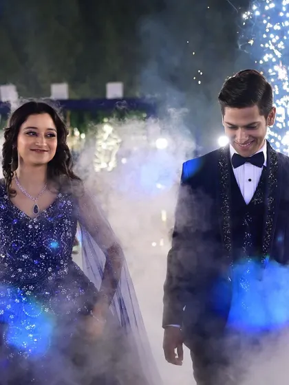 A dreamy entry for the couple, walking through smoke and sparklers. I help conceptualize these moments to make your sangeet entry as grand as the performance itself.