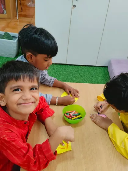 A beaming smile during our Janmashtami craft session. The joy of creating something with their own hands is a powerful part of the learning process.