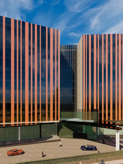 A close-up rendering of the solar passive business building. This view details the interplay between the vertical fins and the glass facade, showing how the design creates a visually complex surface that is also highly functional.